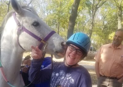 Friendly Horse licking girl's ear
