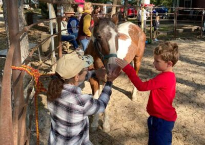 Maureen teaching boy about a horse